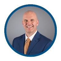Dr. Robert Camenzuli Man wearing a suit and tie