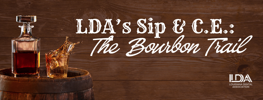 LDA's Sip & C.E.: The Bourbon Trail. A wood background, bourbon barrel, and a glass of bourbon